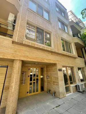 a large building with a door and windows at Sunny in Varna City