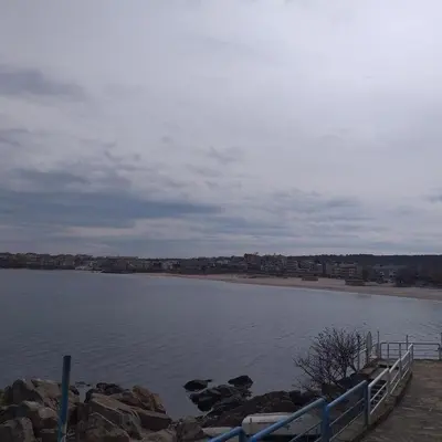 a view of a body of water with a fence at Z&Z Apartment in Sozopol