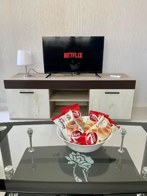 a table with a bowl of food on a desk at Apartman Kuba in Primorsko