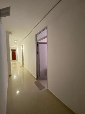 an empty hallway with a door in a building at Studios & Apartments Perla in Sunny Beach