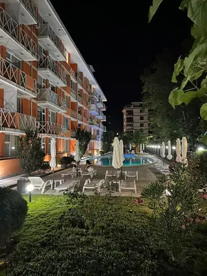 a swimming pool in front of a building at night at Gerber Residence 2 in Sunny Beach