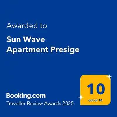a yellow sign with a sun wave appointment prestige at Sun Wave Apartment Presige in Sveti Vlas