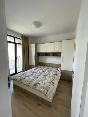 a bedroom with a large bed in a room at Aivazovski park - Pomorie SP apartments in Pomorie