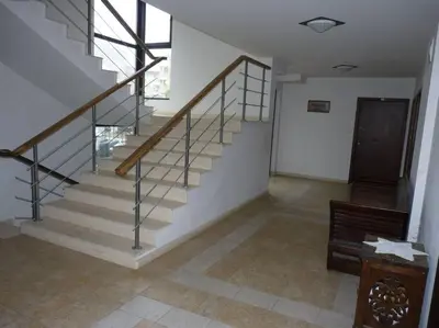a staircase in a house with a stair case at Апартамент Хармония in Sozopol