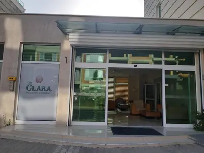 a glass door of a building with a sign on it at Апартамент BLUE SUMMER - уют, близо до морето in Burgas City