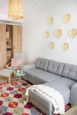 a living room with a couch and hearts on the wall at COZZIE by RV Apartments in Varna City