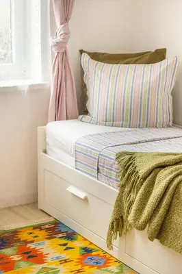 a bedroom with a bed with a white drawer at COZZIE by RV Apartments in Varna City