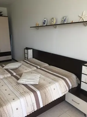 two beds sitting next to each other in a bedroom at Sunny Gardens in Sunny Beach