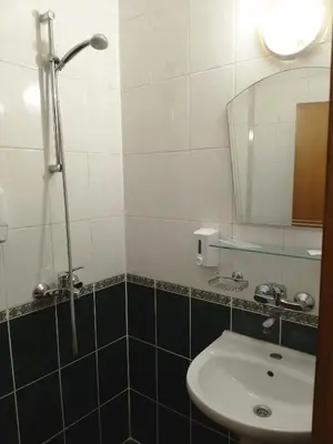 a bathroom with a sink and a mirror at Санта Марина in Varna City