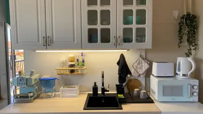 a kitchen with a counter top with a microwave at Studio Seaven, Lozenets in Lozenets