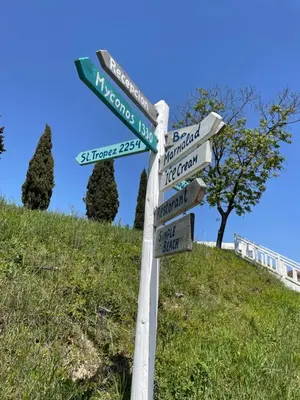 a pole with street signs on top of a hill at Studio B28 Sunny Island Chernomorez in Chernomorets