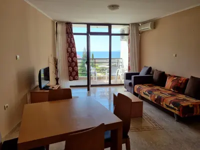 a living room with a couch and a table at Luxsus Apartment Diamond Sveti Vlas in Sveti Vlas
