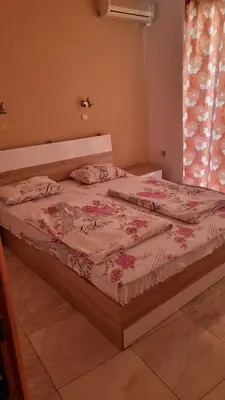 a bed sitting in a bedroom with at Luxsus Apartment Diamond Sveti Vlas in Sveti Vlas
