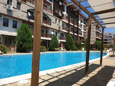 a swimming pool in front of a apartment building at MitProt Panorama Bay 2 Luks Studio 159 in Sveti Vlas