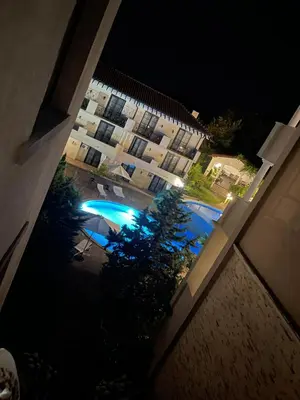 an overhead view of a swimming pool at night at Apartament in The Cliff Beach & Spa **** in Obzor