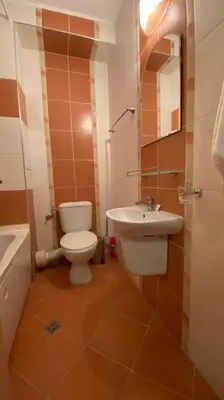 a bathroom with a toilet and a sink at Sozopol Apartcomplex Onegin 2,free parking in Sozopol