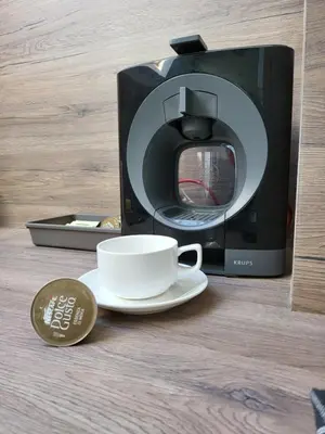 a microwave oven with a coffee cup and a coin at AMAYA in Varna City
