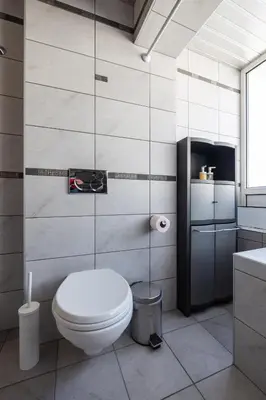 a bathroom with a toilet and a sink at Promenade Rooftop Flat in Varna City
