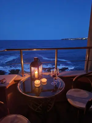 a table with a candle and two glasses on a boat at Sozopol Bulgaria VIP zona in Sozopol