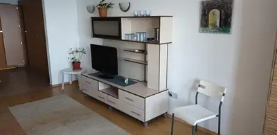 a living room with a tv on a dresser at Sozopol Bulgaria VIP zona in Sozopol