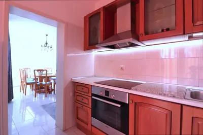 a kitchen with a sink and a stove top oven at Ravda Residence in Ravda