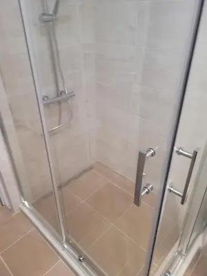 a shower with a glass door in a bathroom at Sozopoli Hills, app B7 in Sozopol