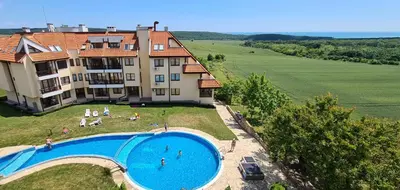 an aerial view of a large building with a swimming pool at BohoTide by the Sea in Bliznatsi