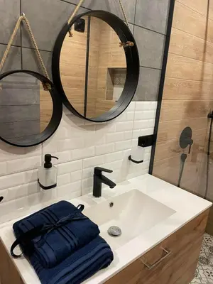 a bathroom with a sink and a mirror at Sea Scenery Apartment in Burgas City