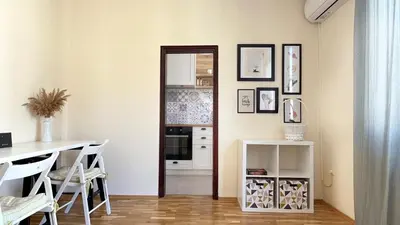 a kitchen with a table and a dining room at Lovely Apartment with Balcony in Pomorie Old Town by Flat Mаnаger in Pomorie
