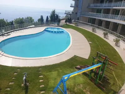 an overhead view of a large swimming pool in a building at Studio Silver Terace with Sea View for 4 person in Byala
