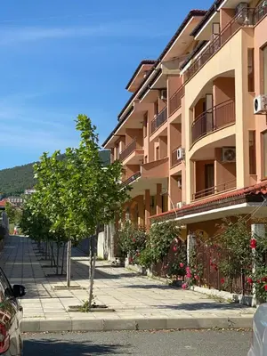 a street in front of a apartment building at Horizon Apartament Gut in Sveti Vlas