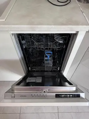 a dishwasher in a kitchen with its door open at Horizon Apartament Gut in Sveti Vlas