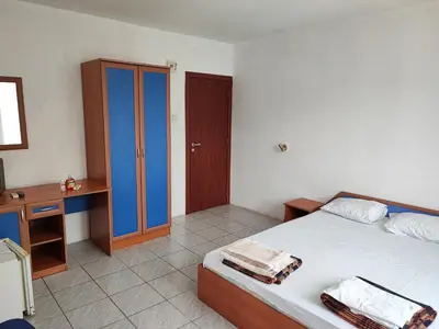 a bedroom with a bed and a desk and a bed sidx sidx sidx at Fa Mol in Sunny Beach