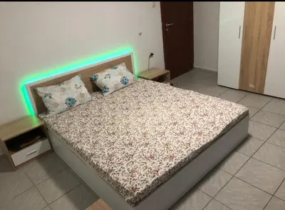 a bedroom with a bed with a light on it at Fa Mol in Sunny Beach