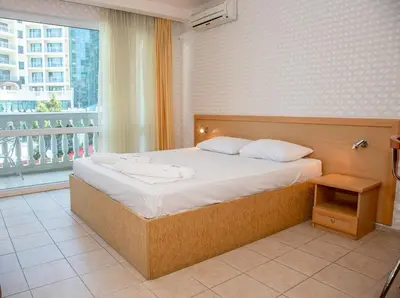 a bedroom with a large bed and a large window at Sunny Studio in Sunny Beach by Flat Mаnаger in Sunny Beach