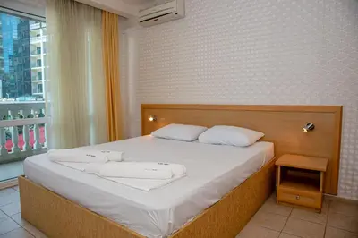 a bedroom with a bed with two towels on it at Sunny Studio in Sunny Beach by Flat Mаnаger in Sunny Beach