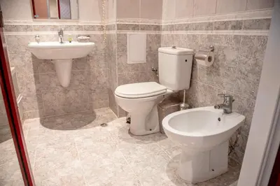 a bathroom with a toilet and a sink at Sunny Studio in Sunny Beach by Flat Mаnаger in Sunny Beach