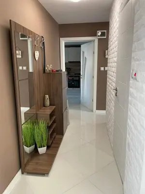 a bathroom with a walk in shower and plants at My Sweet Home in Burgas City