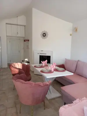 a living room with a couch and a table and chairs at Perla 2 studio in Burgas City
