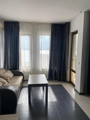 a living room with a couch and a coffee table at Luxory Apartament on the Seaside, Gradina beach, St Nicholas Complex in Chernomorets