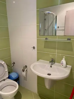 a bathroom with a sink and a toilet at Luxory Apartament on the Seaside, Gradina beach, St Nicholas Complex in Chernomorets