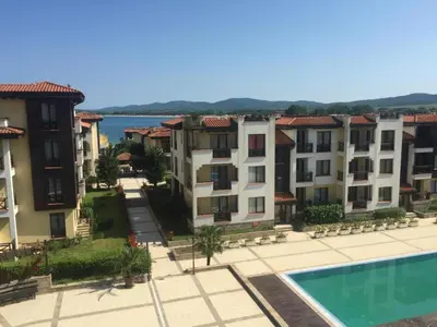 a view of some apartment buildings and a swimming pool at Luxory Apartament on the Seaside, Gradina beach, St Nicholas Complex in Chernomorets