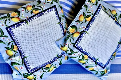a pair of paper napkins sitting on top of a table at Апартамент Limoncini in Sozopol