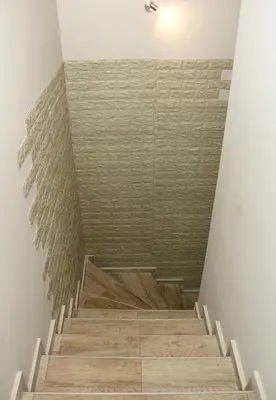 a staircase with wooden floors and a wall at ~ The Blue ~ 1BD Flat near Asparuhovo Sea Garden in Varna City
