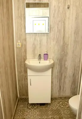 a bathroom with a sink and a toilet at ~ The Blue ~ 1BD Flat near Asparuhovo Sea Garden in Varna City