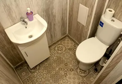 a bathroom with a white toilet and a sink at ~ The Blue ~ 1BD Flat near Asparuhovo Sea Garden in Varna City