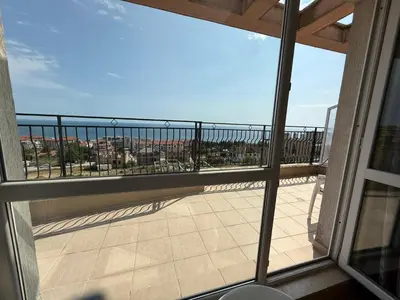 a balcony with a view of the ocean at Nieli-1 SP apartments in Byala