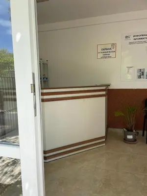 a room with a wall with a door and a plant at Nieli-1 SP apartments in Byala