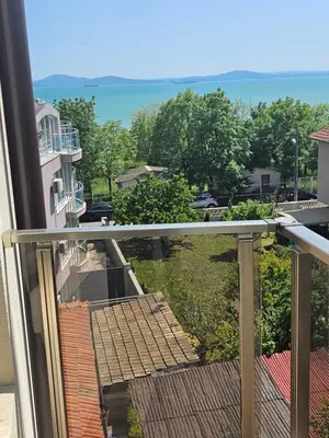 a balcony with a view of a yard at Апартамент ИВАНОВИ Сарафово in Burgas City