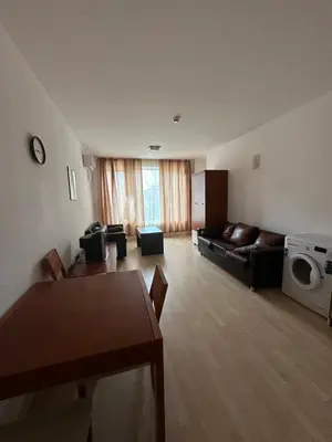 a living room with a couch and a table at Stella Polaris 1 Apartments in Sunny Beach